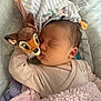 Charlotte participe au concours pour gagner de l'argent avec cette photo : baby, sleeping, plush_toy, bambi, blanket, pink, soft_texture, cozy, infant, cute, child, face, head, clothing, rest, peaceful, indoors, person, comfort, toy
