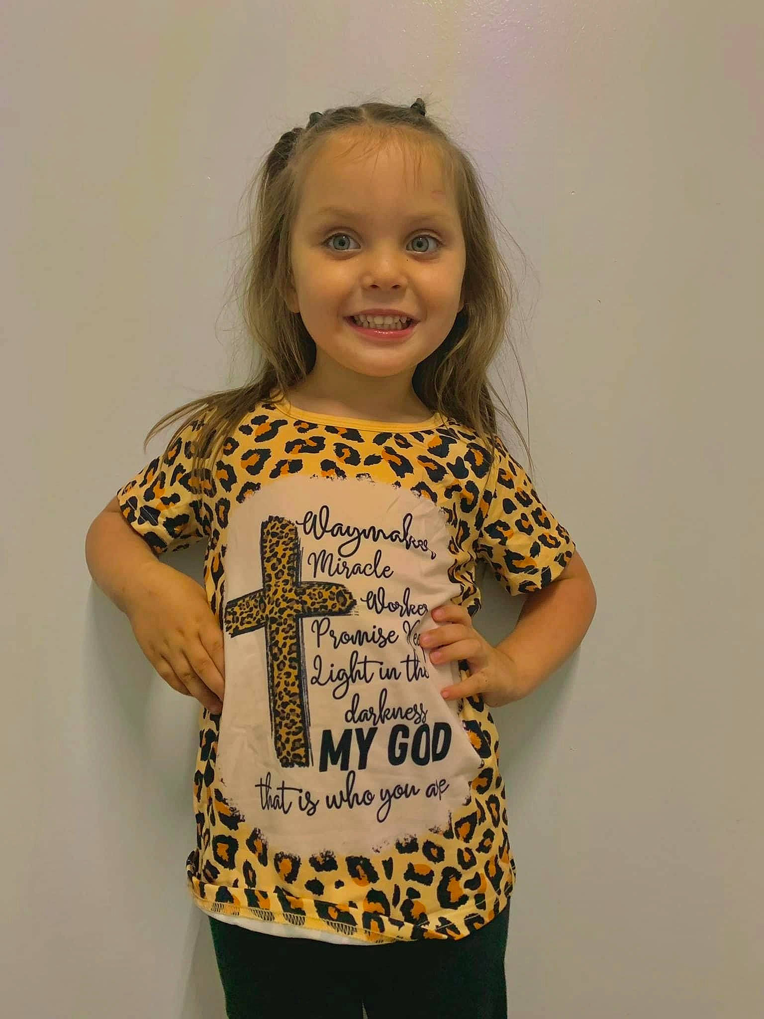 Emma Grace is registered to the contest to win money with this photo: arm, baby_toddler_clothing, child, electric_blue, face, fashion_design, font, hair, happy, head, joy, leggings, neck, pattern, person, sleeve, smile, t_shirt, toddler, top