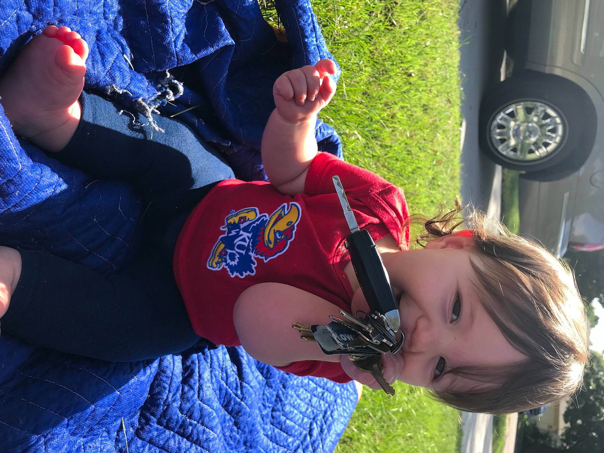 Madison is registered to the contest to win money with this photo: black_hair, blue, cool, electric_blue, fashion, fun, gesture, glove, grass, green, headgear, human_leg, leisure, person, plant, street_fashion, thigh, tire, wheel, yellow