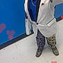 child, smiling, hat, blazer, bow_tie, chain, blue_shirt, patterned_pants, shoes, floor, wall, hearts, indoor, portrait, fashion, happy, person, standing, full_body, stylish