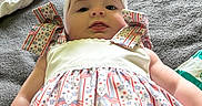 Raekyn joined the competition — help win amazing prizes! baby, child, headband, bow, dress, patterned_clothing, stars, stripes, flag, indoor, bed, fabric, texture, person, infant, cute, lying_down, white, colorful, soft