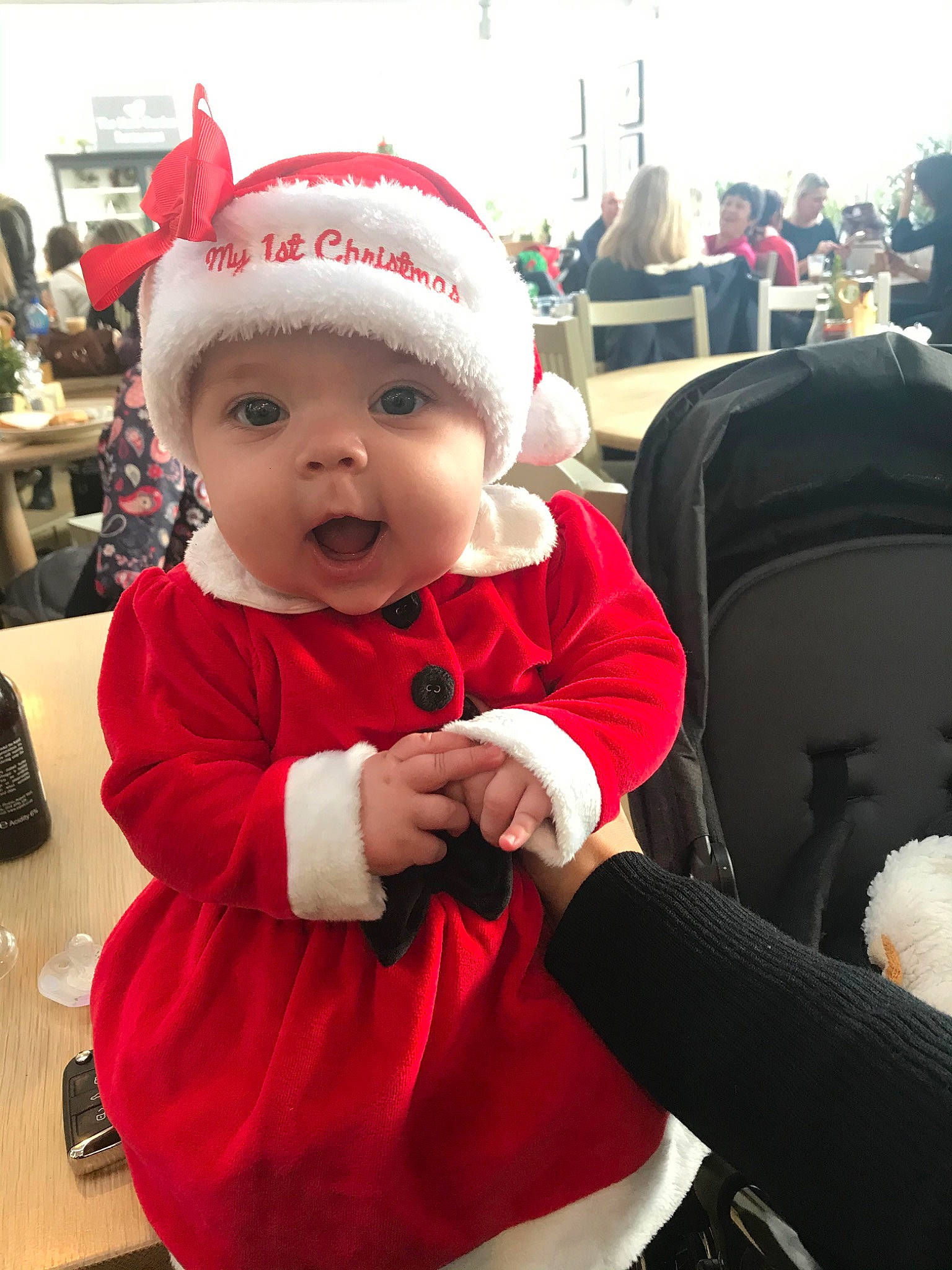 Chloe joined the competition — help win amazing prizes! baby, child, christmas, christmas_eve, costume, ear, electronic_device, fictional_character, happy, head, headgear, headwear, holiday, person, red, santa_claus, toddler, winter