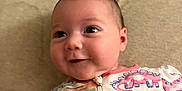 Kinsley joined the competition — help win amazing prizes! baby, clothing, coat, cushion, dress, face, happy, head, homedecor, jacket, longsleeve, newborn, pajamas, pattern, person, photography, portrait, quilt, sleeve, smile