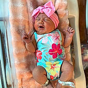 Stella joined the competition — help win amazing prizes! newborn, baby, infant, blanket, pink_bow, headband, floral_onesie, hospital_bracelet, sleeping, cute, peaceful, skin, legs, feet, hands, fingers, hospital_bassinet, soft_texture, indoor, portrait