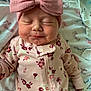 Stella is registered to the contest to win money with this photo: baby, sleeping, pink_bow, headband, floral_onesie, blanket, footprints, newborn, cute, infant, soft, clothing, peaceful, adorable, child, portrait, indoors, sleep, baby_girl, rest