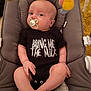 Theo joined the competition — help win amazing prizes! baby, infant, pacifier, onesie, text_on_clothing, baby_seat, cushion, soft_toys, indoor, cute, child, relaxing, clothing, human, newborn, portrait, baby_boy, baby_girl, comfort, humor