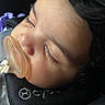 baby, infant, sleeping, pacifier, face, portrait, close_up, eyes_closed, eyelashes, cheeks, dark_hair, car_seat, harness, cozy, resting, peaceful, child, indoor, photography, side_profile