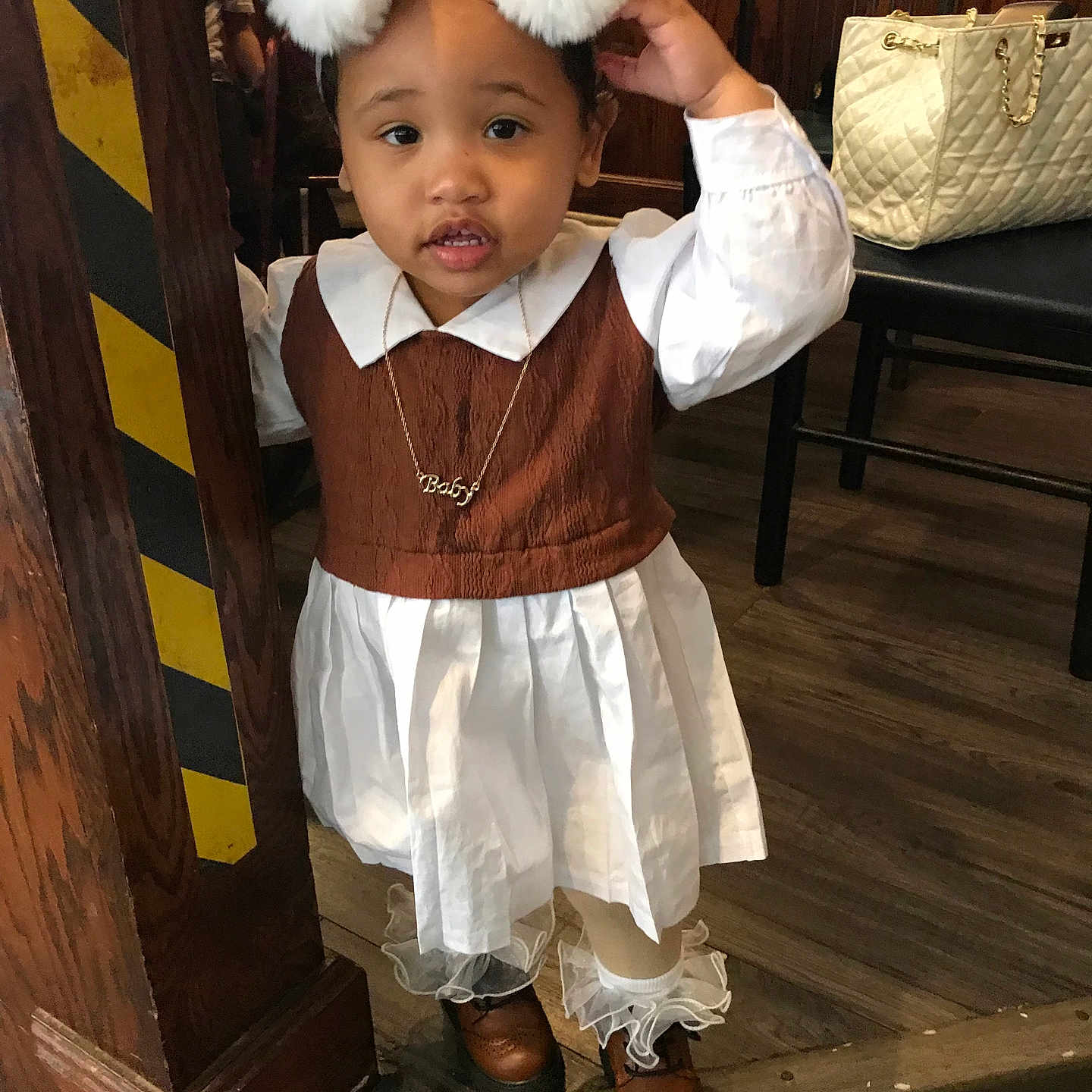 Amani Hawkins is registered to the contest to win money with this photo: accessories, bag, child, clothing, costume, dress, face, female, footwear, girl, handbag, hardwood, head, jewelry, necklace, person, photography, portrait, shoe, wood
