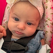 Raya joined the competition — help win amazing prizes! baby, infant, child, blue_eyes, headband, bow, car_seat, safety_harness, floral_pattern, pink, clothing, cute, face, portrait, young_child, seatbelt, soft_fabric, closeup, expression, person