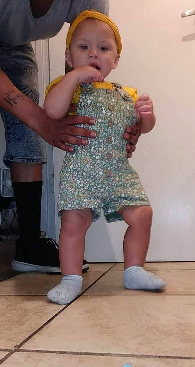 Amarianna Kelly is registered to the contest to win money with this photo: baby, baby_toddler_clothing, clothing, dress, fun, gesture, happy, human_leg, joint, knee, leg, nail, person, shoe, shoulder, sneakers, thigh, thumb, toddler, trunk