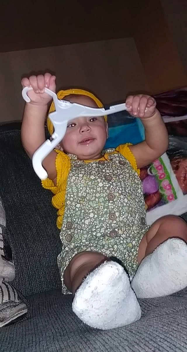 Amarianna is registered to the contest to win money with this photo: baby, baby_toddler_clothing, chair, child, comfort, event, finger, fun, hand, happy, headgear, headwear, human_leg, lap, leisure, mouth, person, skin, thigh, thumb