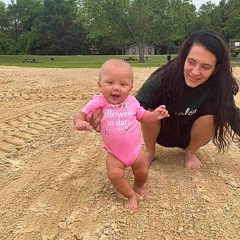 Amarianna joined the competition — help win amazing prizes! baby_toddler_clothing, finger, gesture, grass, hand, happy, human_body, joy, leg, mouth, people_in_nature, person, pink, plant, skin, sky, sleeve, smile, summer, thigh