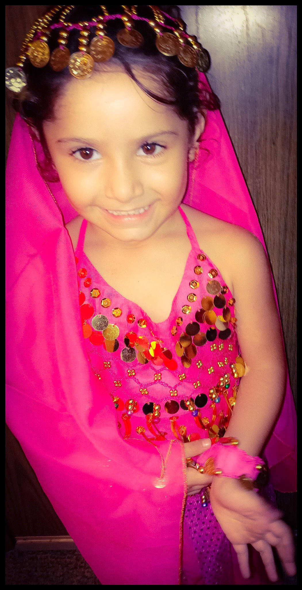 Kelani is registered to the contest to win money with this photo: black_hair, cheek, child, day_dress, eye, eyelash, face, flash_photography, fun, happy, iris, jewellery, joy, lip, magenta, neck, person, pink, skin, sleeve