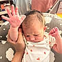 Aleia Rose joined the competition — help win amazing prizes! baby, infant, hand, onesie, clothing, person, face, arm, cushion, pattern, ladybug, cloud, indoor, newborn, skin, hair, expression, holding, cute, soft