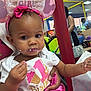 baby, birthday, birthday_girl, headband, cake, party, indoor, child, face, pink, clothing, celebration, people, hand, food, smear, toddler, person, event, happy