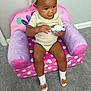 Gianna joined the competition — help win amazing prizes! toddler, child, toy, chair, pink, purple, polka_dot, socks, bow, headband, carpet, indoor, cute, baby, sitting, clothing, person, smile, floor, plush_furniture