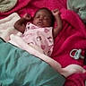 Zia is registered to the contest to win money with this photo: baby, sleeping, blanket, pacifier, bed, cozy, child, infant, sleep, rest, pink, blue, clothing, soft, comfort, arms, peaceful, indoor, person, cute