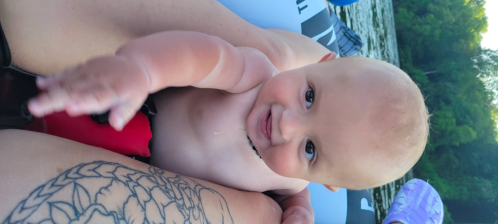 Tre is registered to the contest to win money with this photo: baby, cheek, chest, eyebrow, eyelash, finger, gesture, happy, iris, joy, leisure, lip, mouth, neck, nose, person, plant, skin, smile, toddler