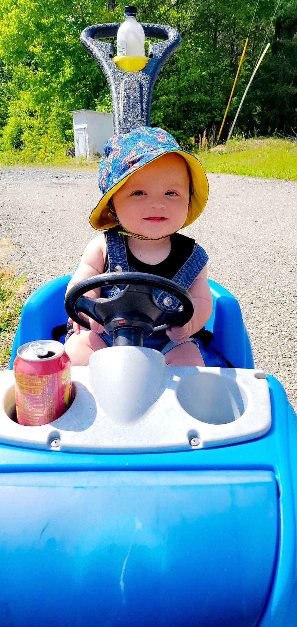 Tre joined the competition — help win amazing prizes! baby, baby_toddler_clothing, child, electric_blue, fun, grass, green, happy, headwear, leisure, outdoor_recreation, person, personal_protective_equipment, photograph, plant, recreation, riding_toy, toddler, travel, water