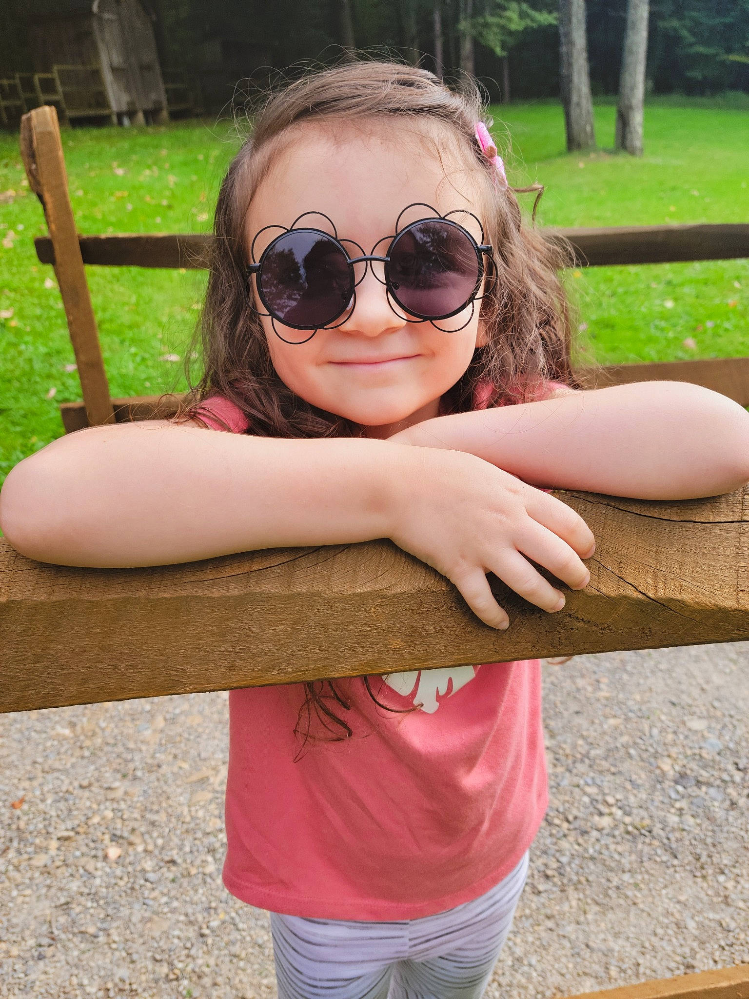 Brayleigh is registered to the contest to win money with this photo: eyewear, face, finger, gesture, glasses, goggles, hair, happy, head, joy, leisure, lip, neck, people_in_nature, person, pink, shoulder, sleeve, smile, sunglasses