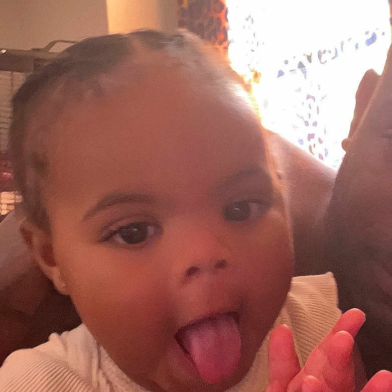 Joshlynn joined the competition — help win amazing prizes! braids, child, clapping, curtain, cute, expression, face, hands, home, indoor, person, playful, portrait, sleeveless_top, smiling, toddler, tongue, warm_light, window, young_child