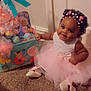 Joshlynn is registered to the contest to win money with this photo: baby, carpet, celebration, child, curly_hair, cute, dress, filter, flower_crown, flowers, gift_basket, indoors, pink, playful, present, shoes, sitting, smiling, toddler, tutu