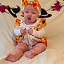 Eden-Rose joined the competition — help win amazing prizes! baby, child, infant, halloween, costume, orange, bow, ruffles, face, expression, sitting, blanket, decoration, witch_hat, broomstick, cute, indoors, holiday, soft, festive
