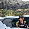 Weston Aydyn is registered to the contest to win money with this photo: adventure, car, cast, casual, child, daylight, greenery, happy, hill, landscape, nature, outdoor, person, portrait, rock, smile, travel, vehicle, window, young