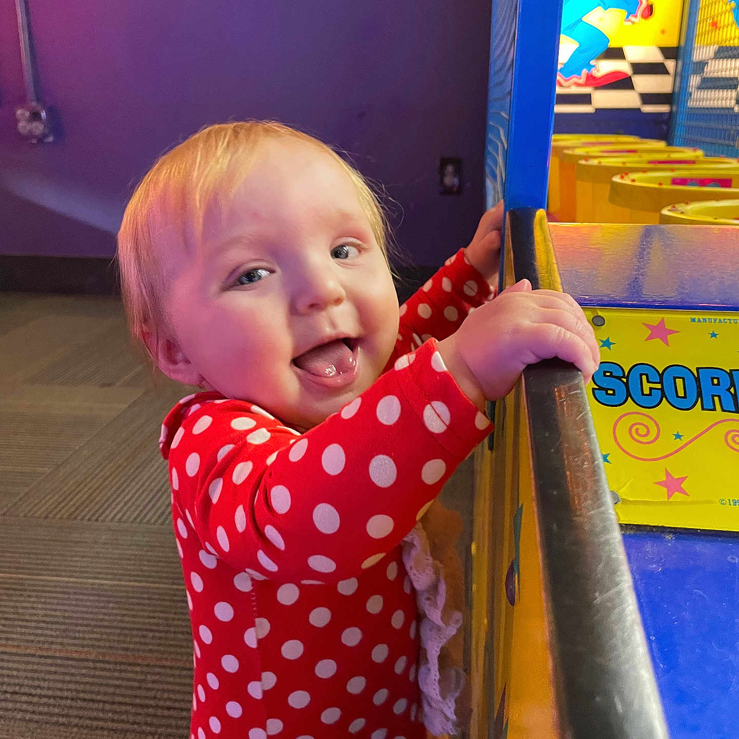 Remi is registered to the contest to win money with this photo: baby, bodypart, boy, child, cricket, cricketbat, face, finger, hand, handrail, head, indoors, male, pattern, person, photography, playarea, polkadot, portrait, sport