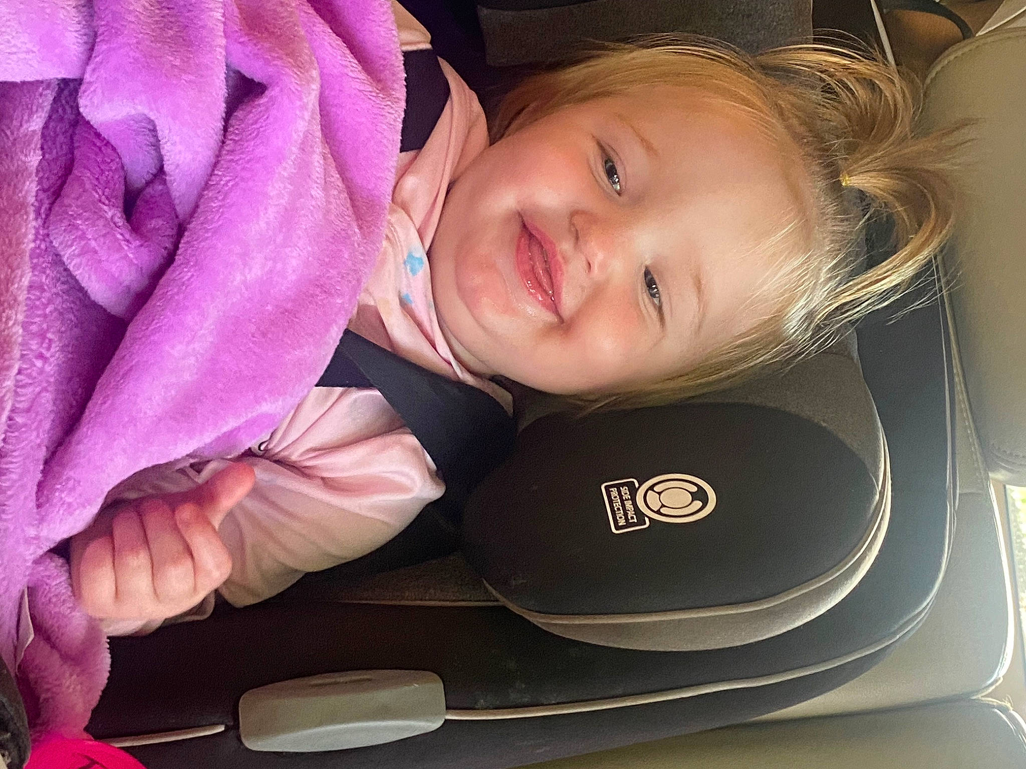 Riley is registered to the contest to win money with this photo: baby_toddler_clothing, cheek, chin, comfort, eye, eyebrow, eyelash, face, finger, flash_photography, hair, happy, head, iris, joy, lip, nose, person, pink, skin