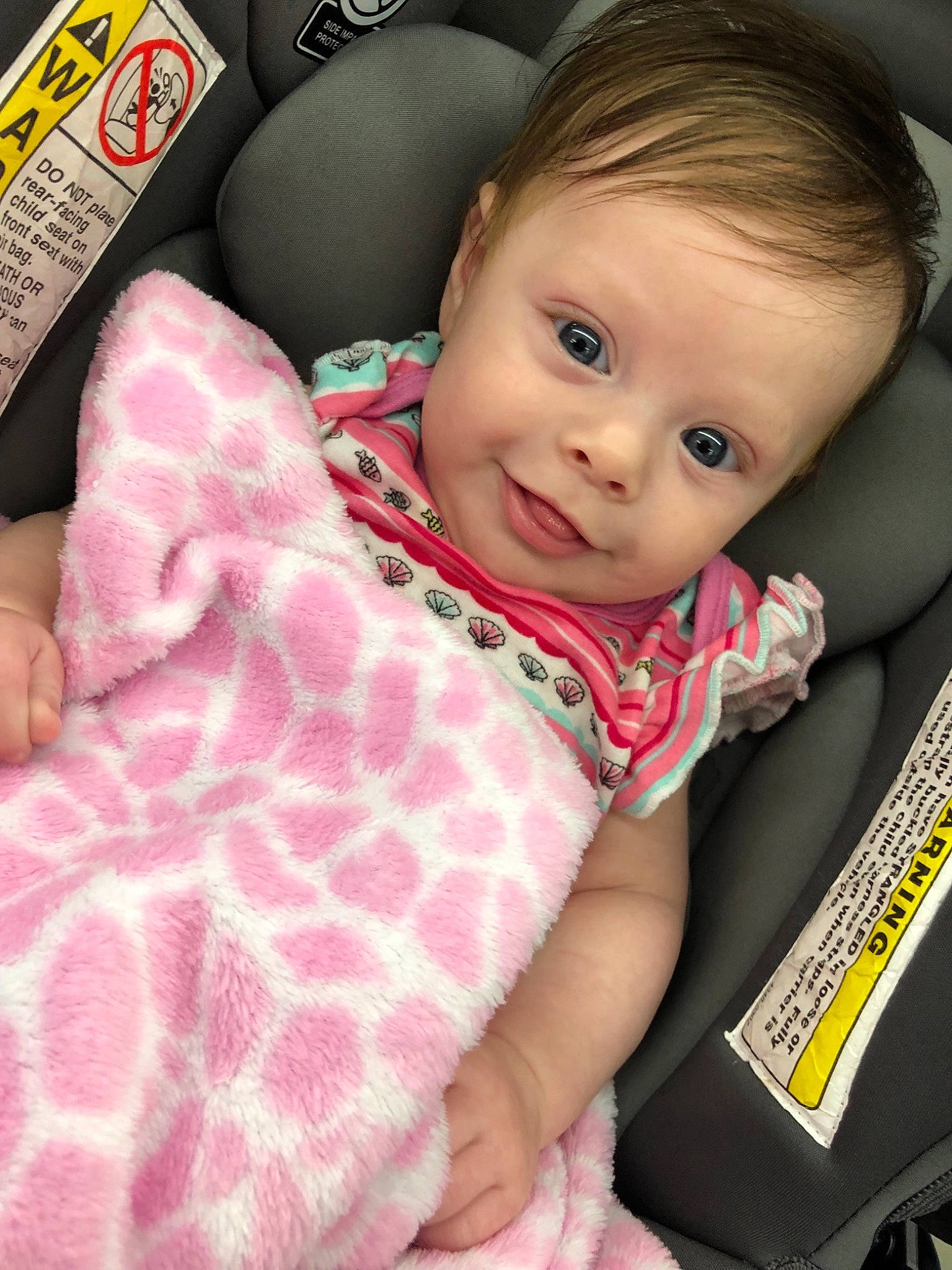 Madeleine is registered to the contest to win money with this photo: auto_part, baby, baby_in_car_seat, baby_products, car_seat, car_seat_cover, cheek, child, head, person, pink, seat_belt, skin, toddler