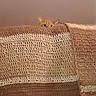 cat, orange_cat, peeking, blanket, brown_blanket, textured_blanket, curious, ears, eyes, indoor, cozy, hiding, cute, pet, feline, soft, home, resting, animal, playful