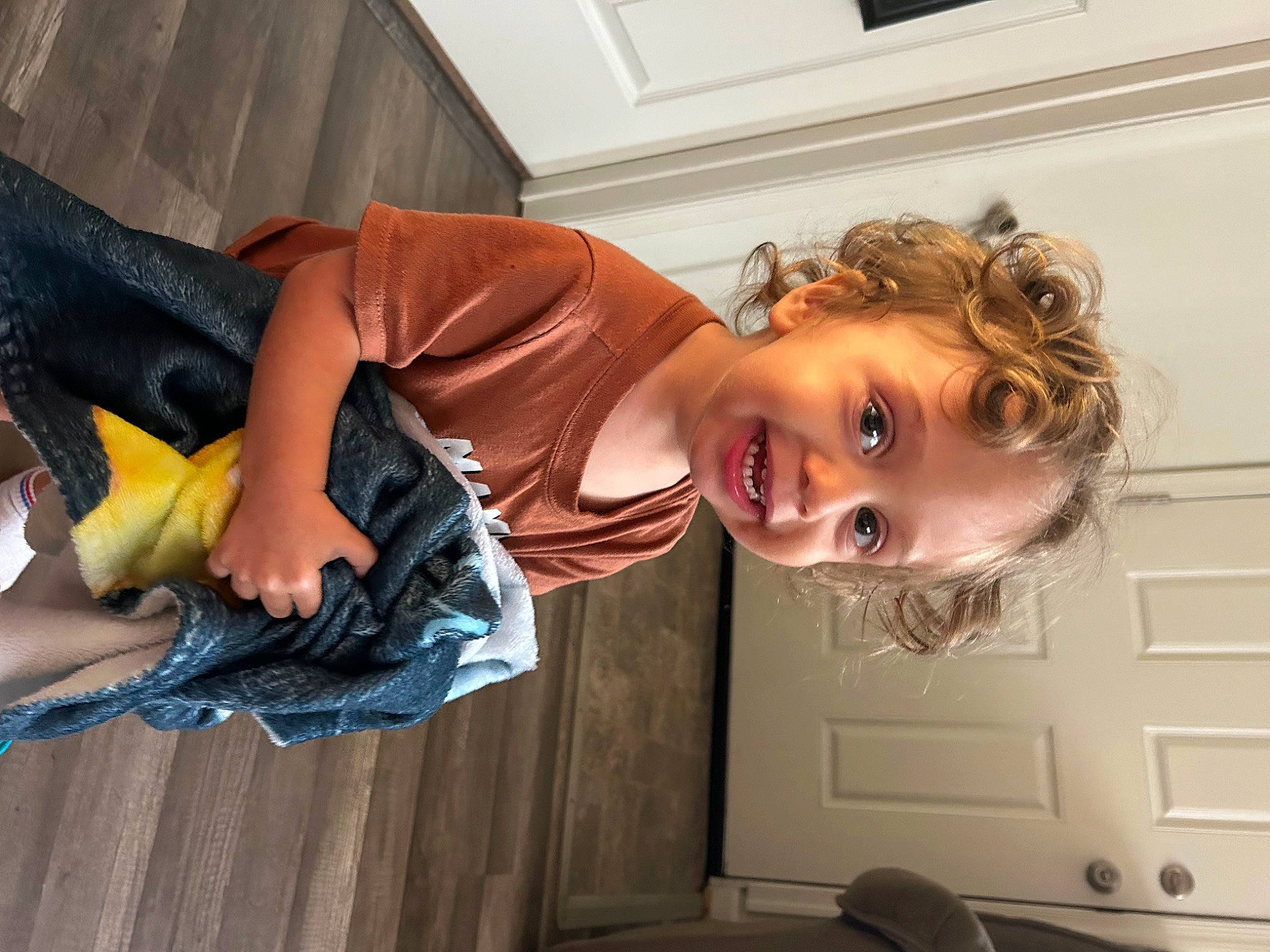 Gabriel is registered to the contest to win money with this photo: blond, child, drawer, electric_blue, flash_photography, flooring, fun, happy, hardwood, human_leg, knee, person, portrait_photography, room, sitting, smile, thigh, toddler, vacation, wood