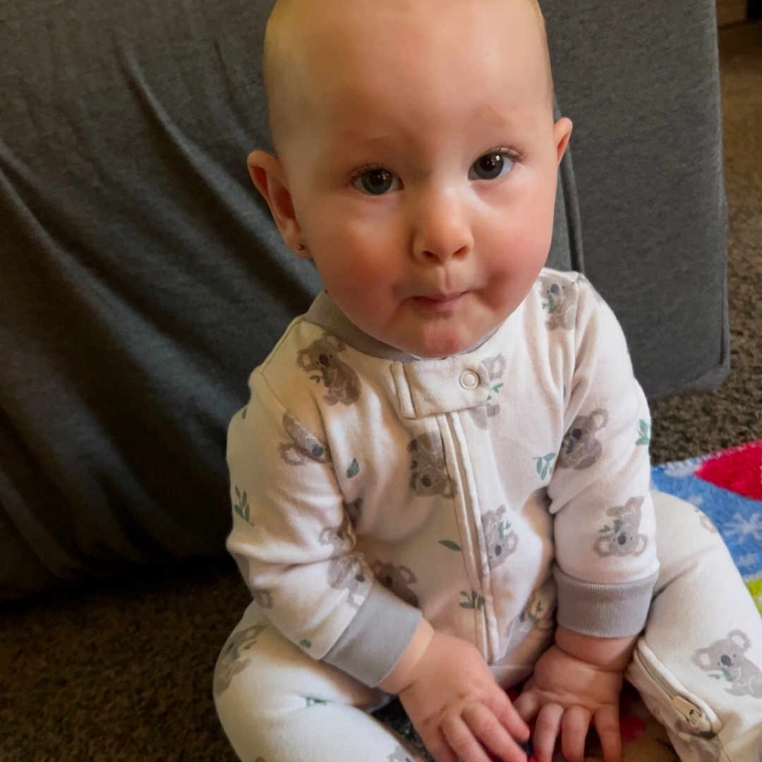 Raven is registered to the contest to win money with this photo: architecture, baby, bodypart, building, clothing, couch, cushion, face, finger, furniture, hand, head, homedecor, indoors, livingroom, pants, person, photography, portrait, sitting