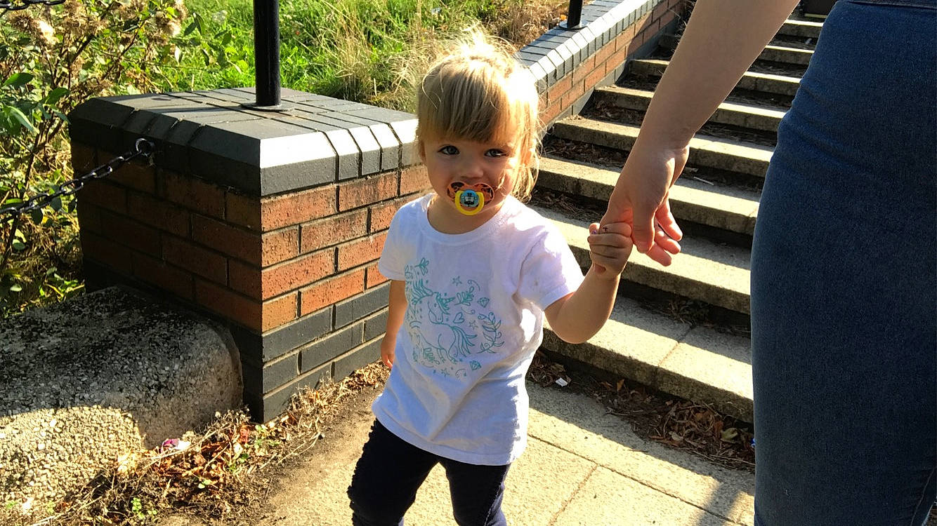 Rosie is registered to the contest to win money with this photo: child, fun, person, play, public_space, recreation, smile, toddler