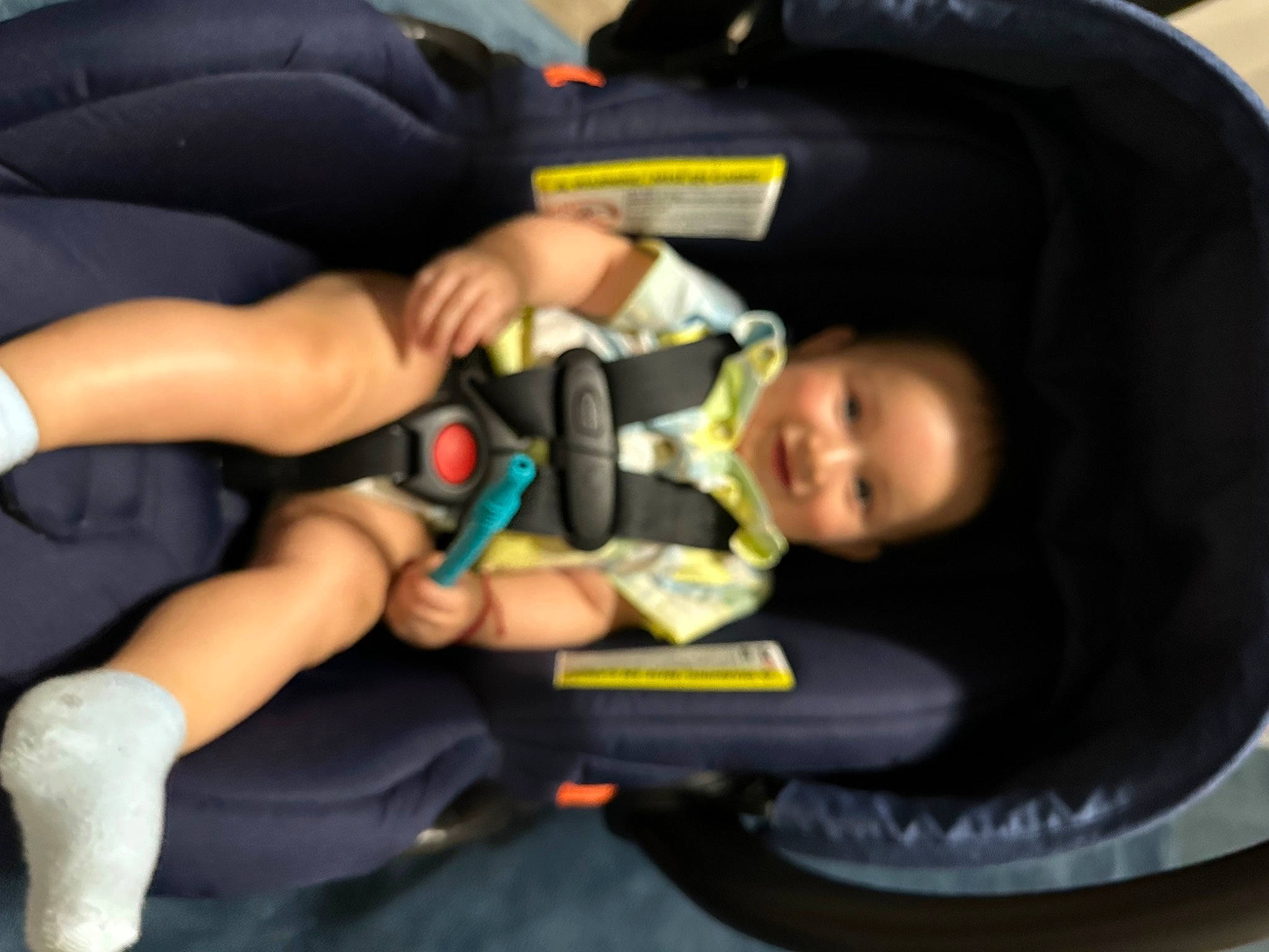 Andres is registered to the contest to win money with this photo: auto_part, baby, baby_carriage, baby_in_car_seat, baby_products, car_seat, child, comfort, finger, fun, gesture, human_leg, joy, knee, lap, nail, person, sitting, thigh, thumb