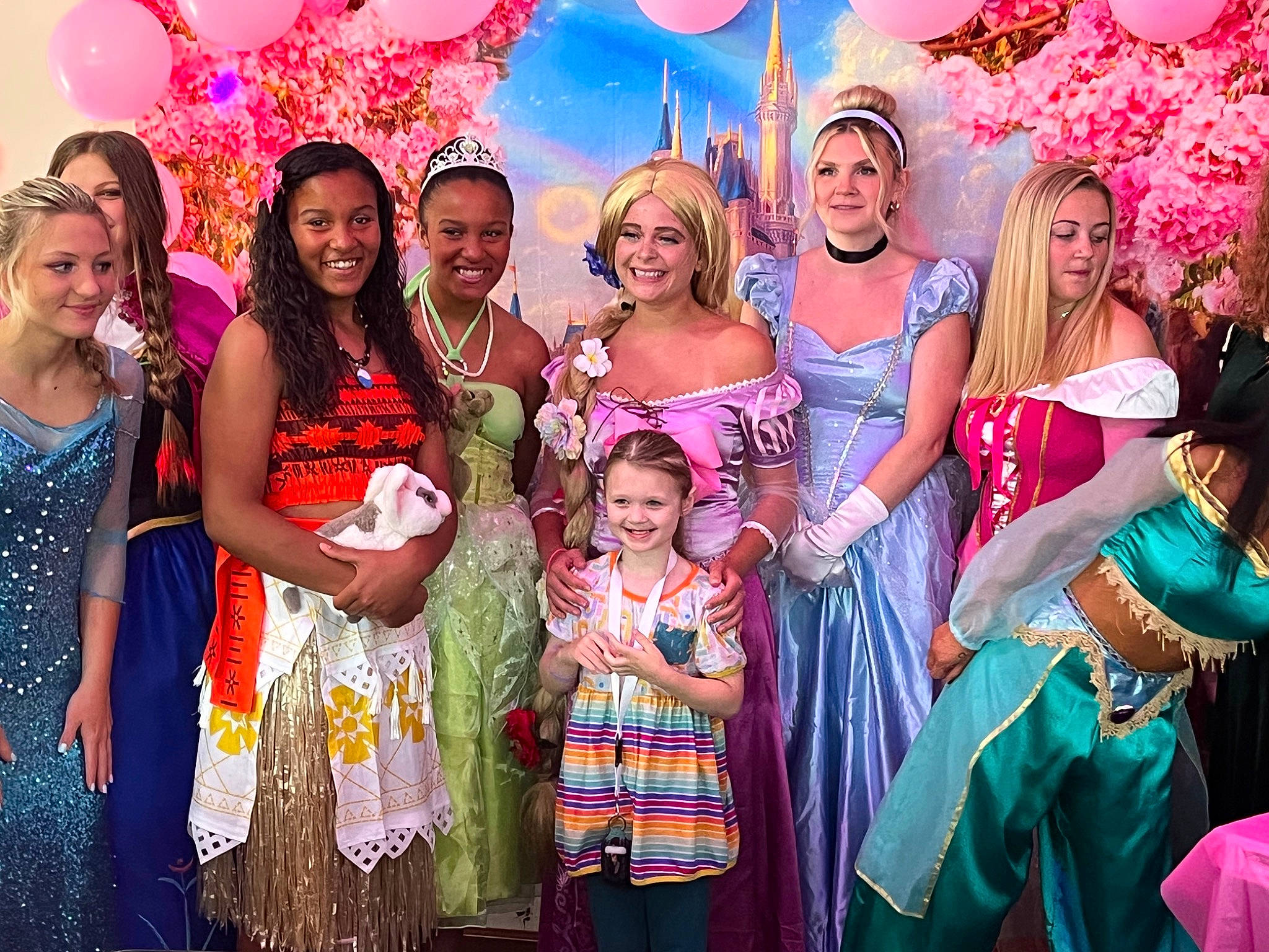 Aubriella is registered to the contest to win money with this photo: balloon, decoration, dress, entertainment, event, facial_expression, fashion_design, formal_wear, friendship, fun, green, happy, joy, leisure, lighting, magenta, party_supply, person, photograph, pink