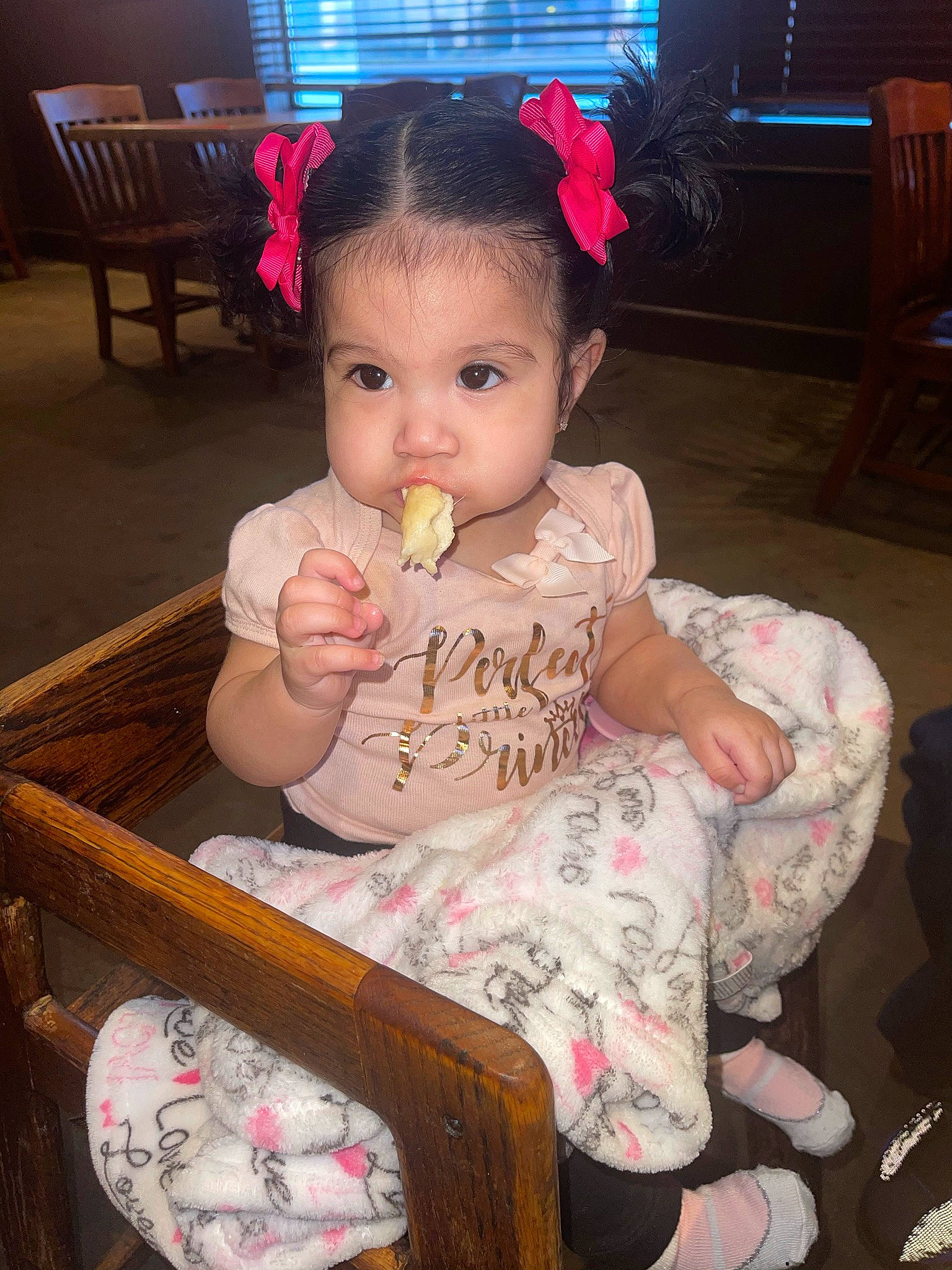 Joselyn is registered to the contest to win money with this photo: baby, baby_toddler_clothing, chair, cheek, child, eye, face, finger, furniture, hair, hand, happy, head, human_body, person, pink, skin, sweetness, table, tableware