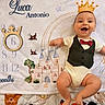 baby, infant, smiling, milestone_blanket, castle, birds, wooden_crown, numbers, months, clothing, vest, bow_tie, lying_down, celebration, cute, happy, child, portrait, indoor, baby_milestone