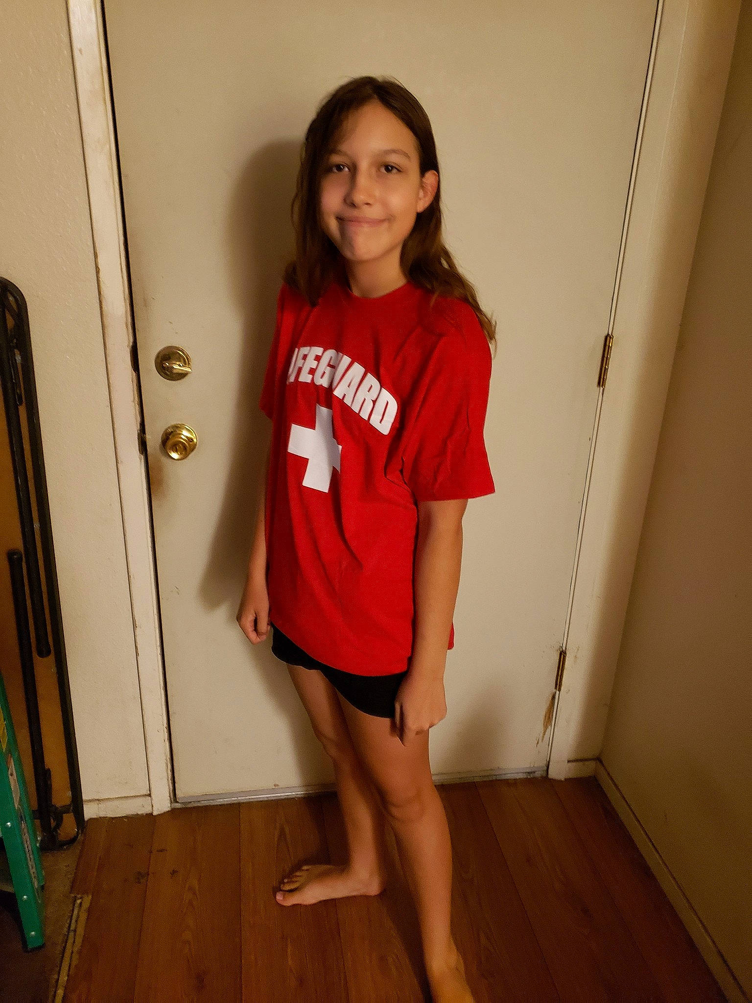 Jasmyn is registered to the contest to win money with this photo: clothing, human_leg, joint, joy, knee, leg, long_hair, person, room, shoulder, sleeve, standing, t_shirt, thigh, trunk