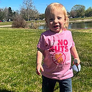 Jasper joined the competition — help win amazing prizes! blue_sky, casual_clothing, child, daylight, garden_tool, grass, happy, holding_object, jeans, nature, outdoor, park, pink_shirt, playtime, pond, smiling, sunny, toddler, trees, young_child