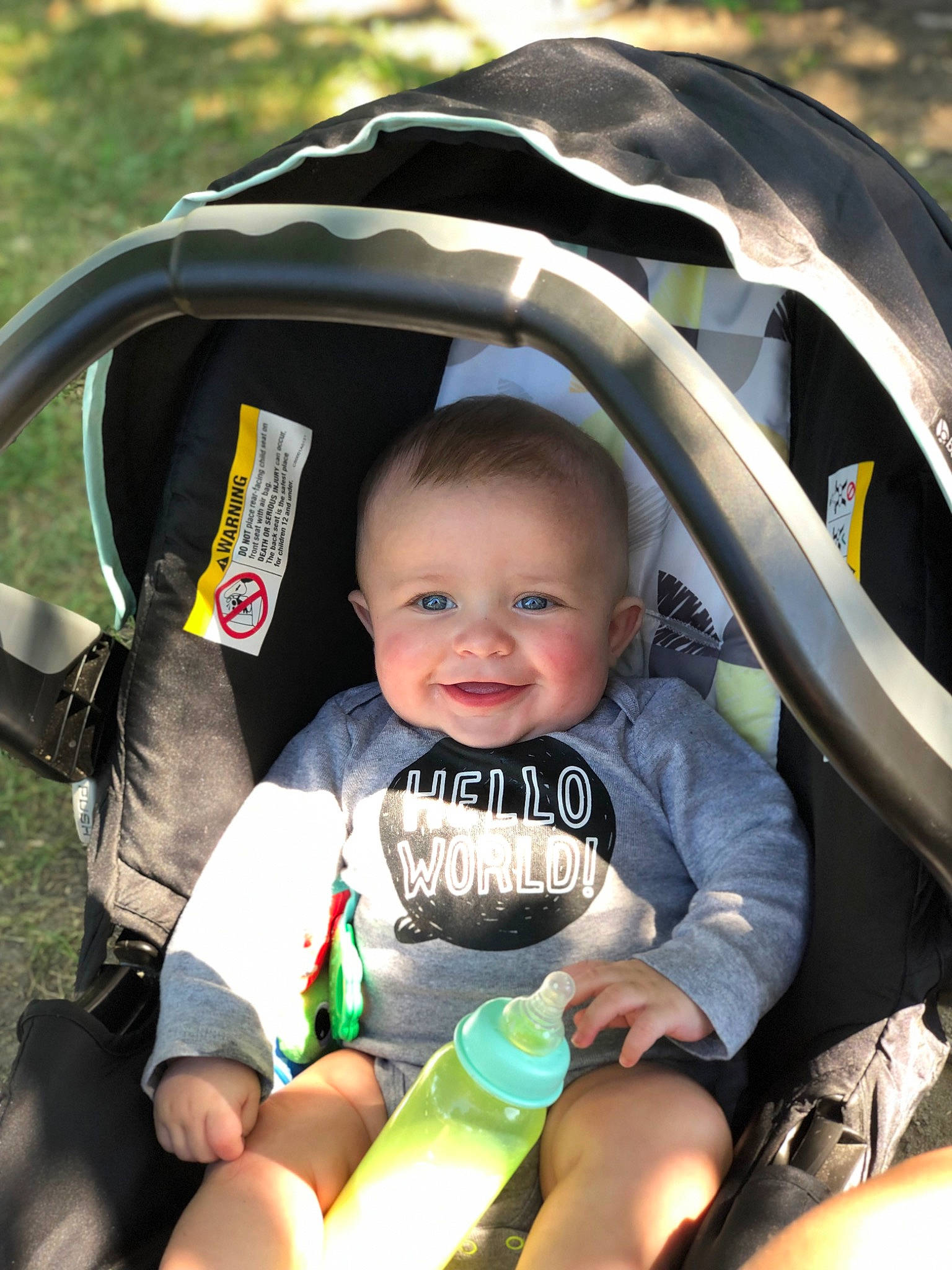 Mason is registered to the contest to win money with this photo: auto_part, baby, baby_carriage, baby_products, baby_toddler_clothing, car_seat, comfort, eye, fun, grass, green, hairstyle, happy, joy, leisure, person, recreation, shorts, skin, smile