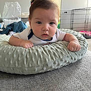 Rene joined the competition — help win amazing prizes! baby, infant, child, portrait, face, eyes, curious, indoor, cushion, pillow, blanket, clothing, sitting, lying_down, home, bedroom, furniture, pet_crate, soft_texture, photography