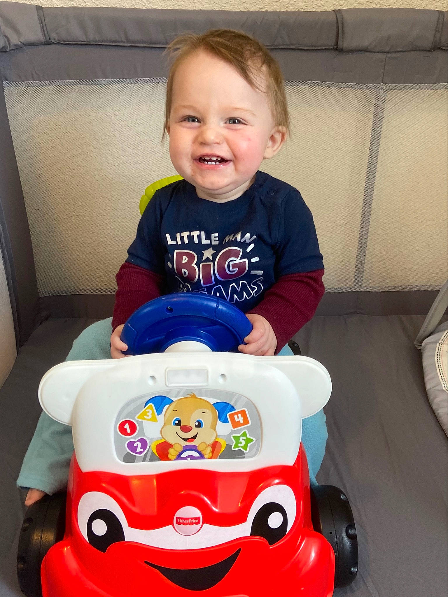 Evan is registered to the contest to win money with this photo: baby, baby_products, baby_toddler_clothing, chair, cheek, child, eye, fun, happy, head, joy, organ, person, product, sitting, skin, sleeve, smile, t_shirt, toddler