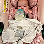 Willow is registered to the contest to win money with this photo: baby, bottle, blanket, car_seat, child, clothing, feeding, footwear, infant, pacifier, person, plaid, pink, sitting, sock, soft, toy, transport, young, milk