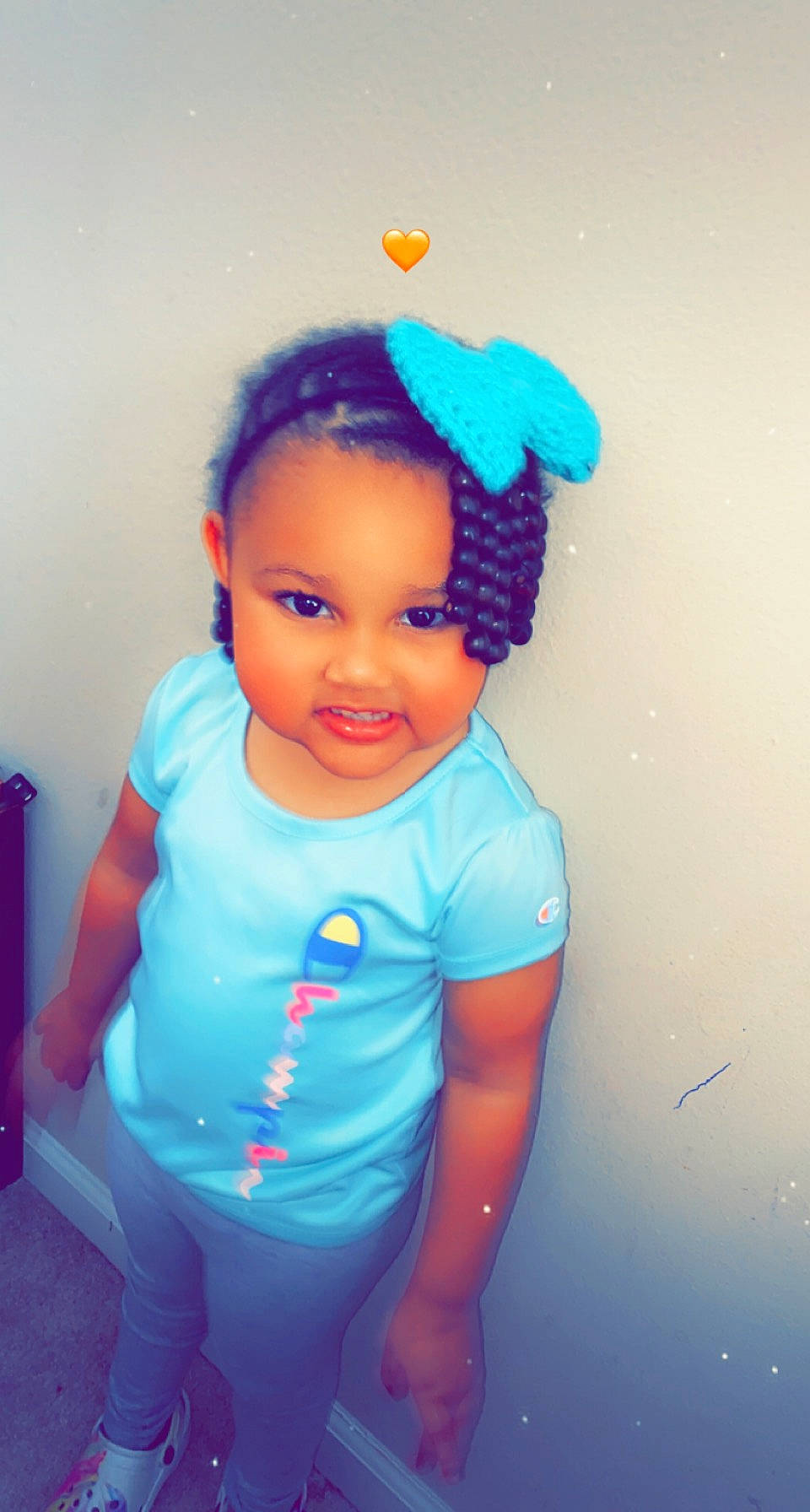 Ivy-camille is registered to the contest to win money with this photo: arm, baby_toddler_clothing, blue, cheek, child, chin, cool, electric_blue, eyebrow, fun, hair, happy, headgear, joy, magenta, neck, person, sleeve, t_shirt, textile