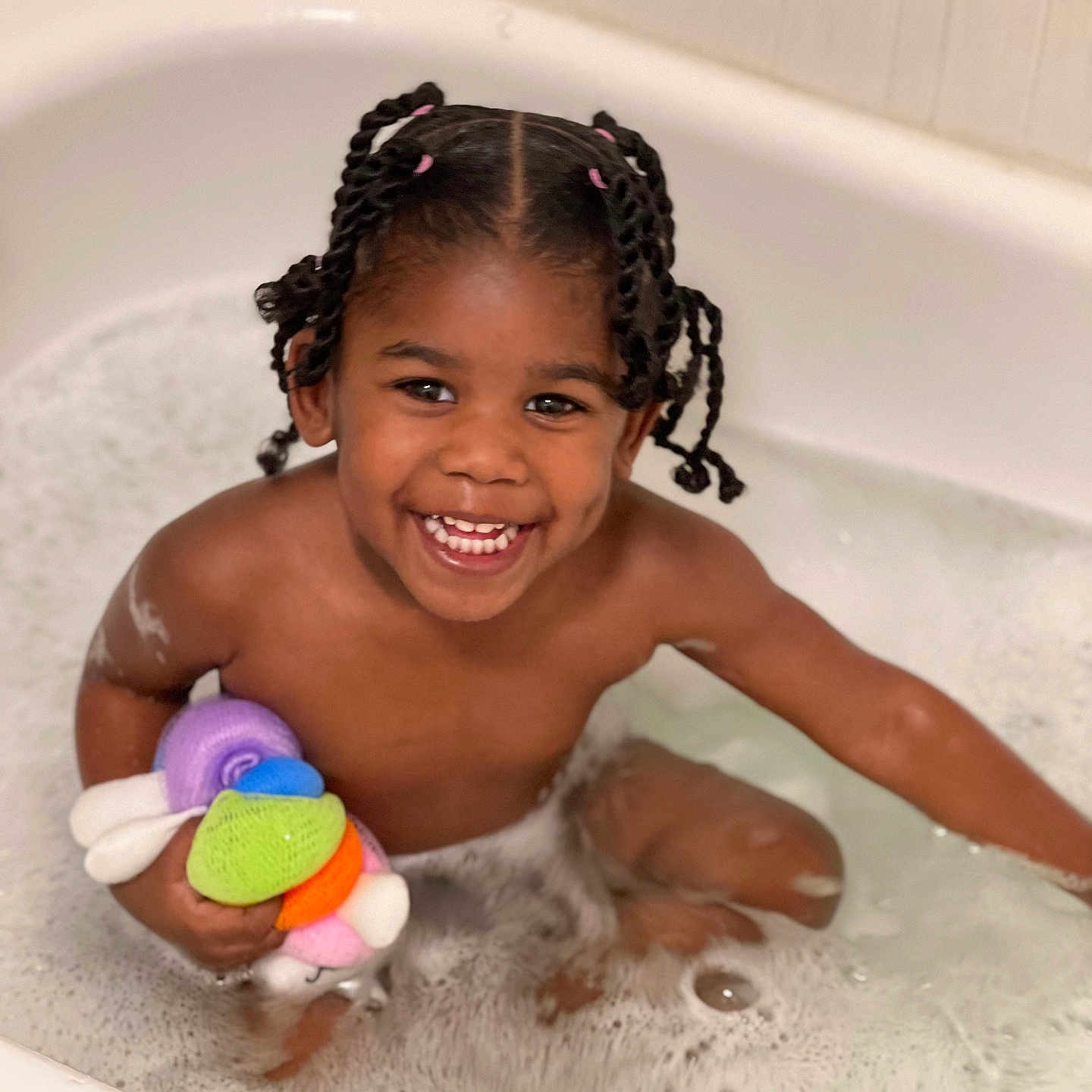 Morgan is registered to the contest to win money with this photo: bathing, bathtub, child, face, female, girl, hair, happy, head, leisureactivities, person, photography, portrait, sitting, smile, sport, swimming, toy, tub, water