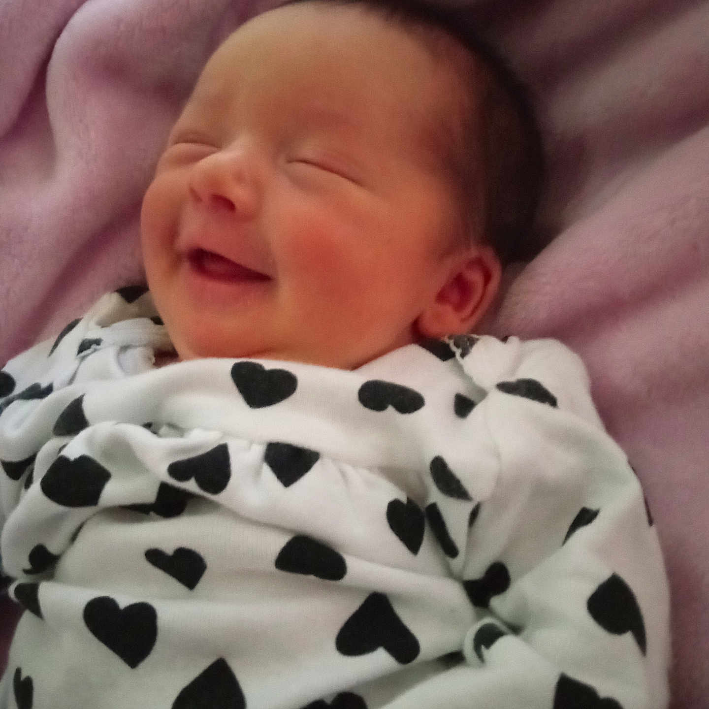 Makenna joined the competition — help win amazing prizes! baby, blanket, child, clothing, cozy, cute, fabric, face, head, heart_pattern, infant, newborn, peaceful, pink, portrait, resting, sleeping, smiling, soft, toddler