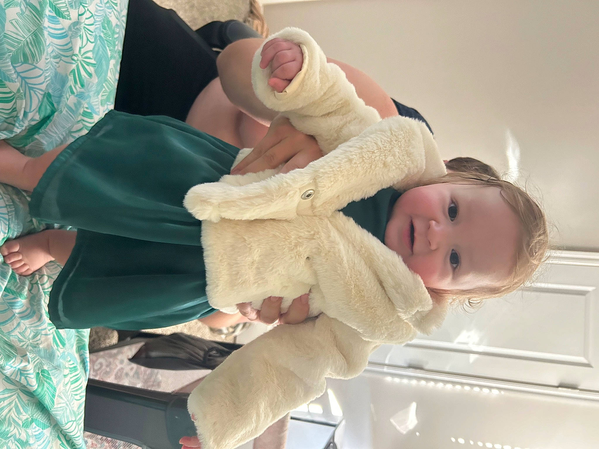 Sophia R joined the competition — help win amazing prizes! baby, baby_products, baby_toddler_clothing, child, comfort, dress, finger, foot, gesture, happy, hat, human_body, human_leg, knee, person, room, sitting, skin, smile, thigh