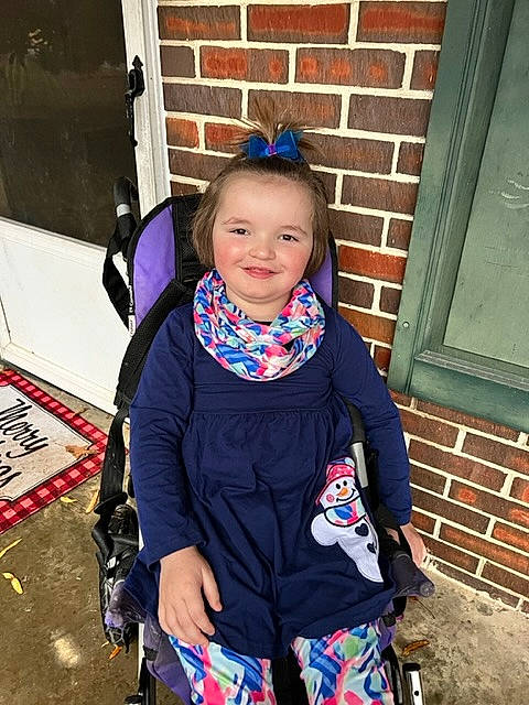 Emma joined the competition — help win amazing prizes! brick, brickwork, child, electric_blue, face, fashion_accessory, fun, happy, iris, jacket, joy, leisure, magenta, person, personal_protective_equipment, recreation, sleeve, smile, standing, t_shirt